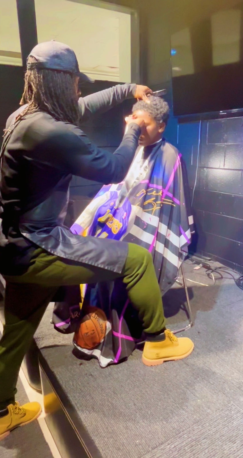 Mentor and mentee during a haircut
